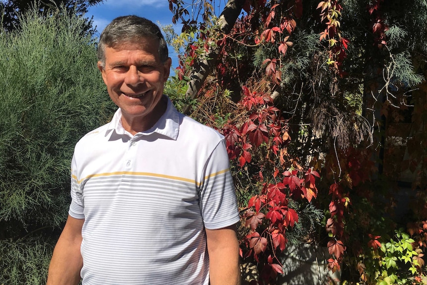 Tasmanian Dr Mike Pook, former CSIRO climatologist and meteorologist, in front of trees, March 2019