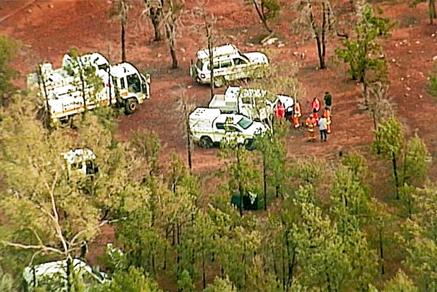 Emergency service workers and vehicles.