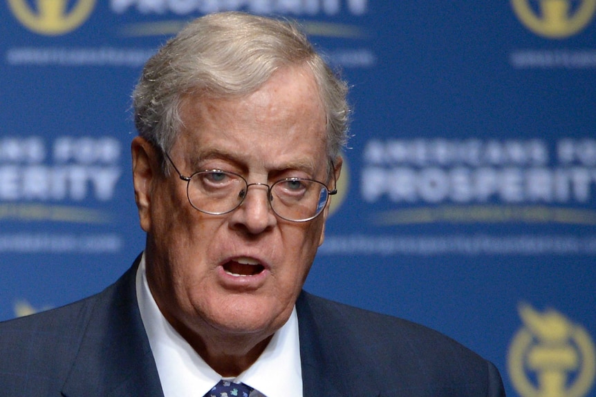 Close-up of David Koch speaking