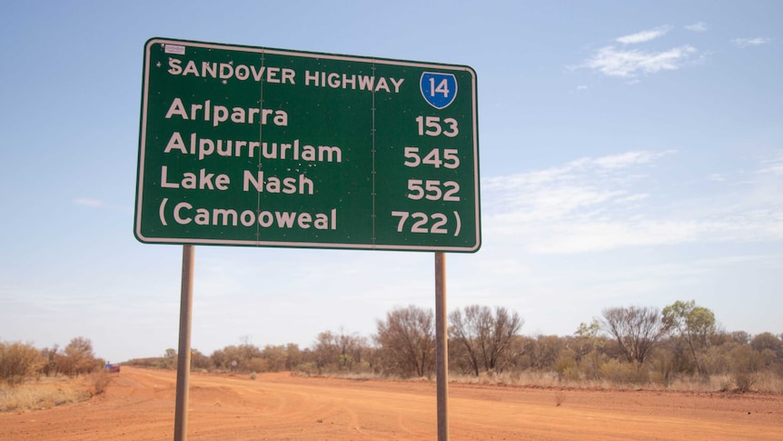 A road sign that says Arlparra is 250 kilometres away from Alice Springs.