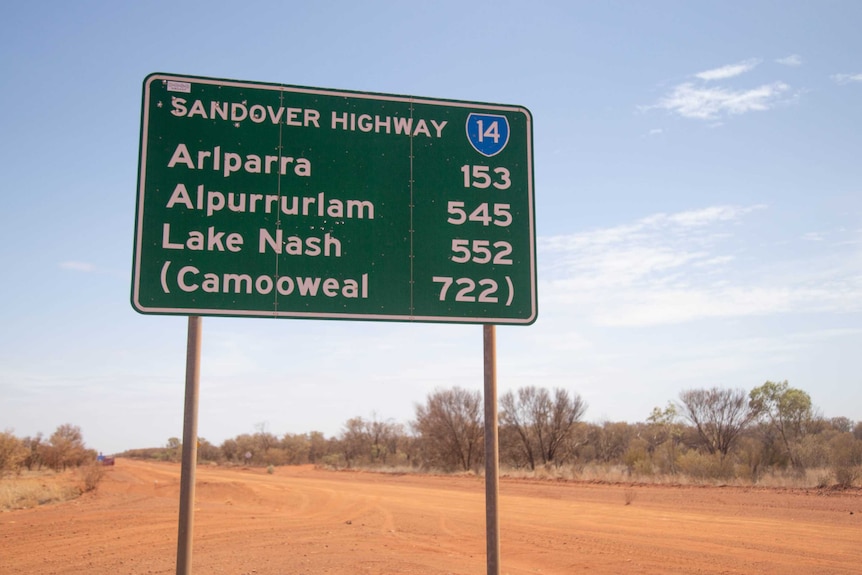 A road sign that says Arlparra is 250 kilometres away from Alice Springs.
