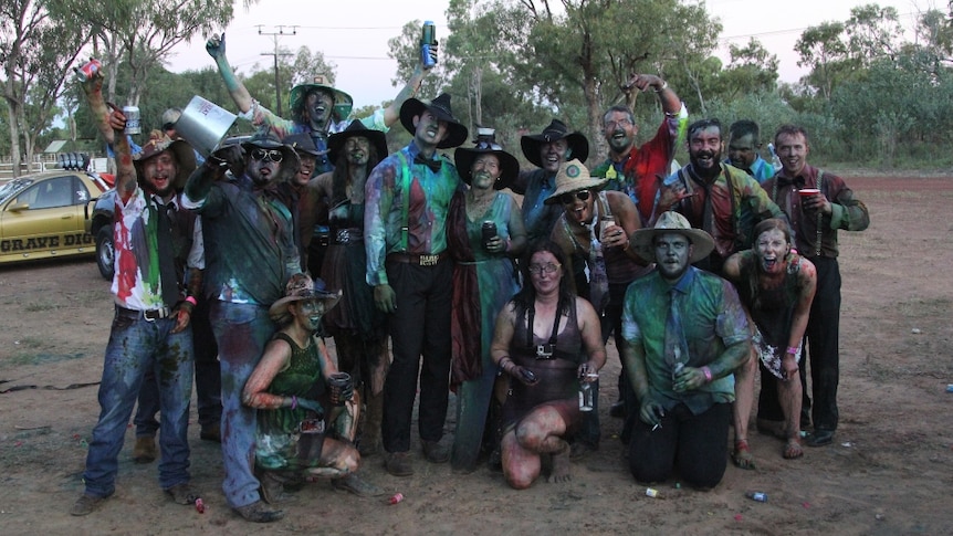A group of people wearing clothes doused in food dye at the Daly Waters B&S Ball
