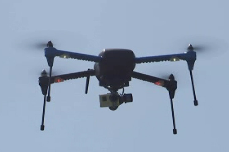 An octocopter drone flies during a demostration.