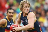 Rory Sloane emerges with the ball for Adelaide