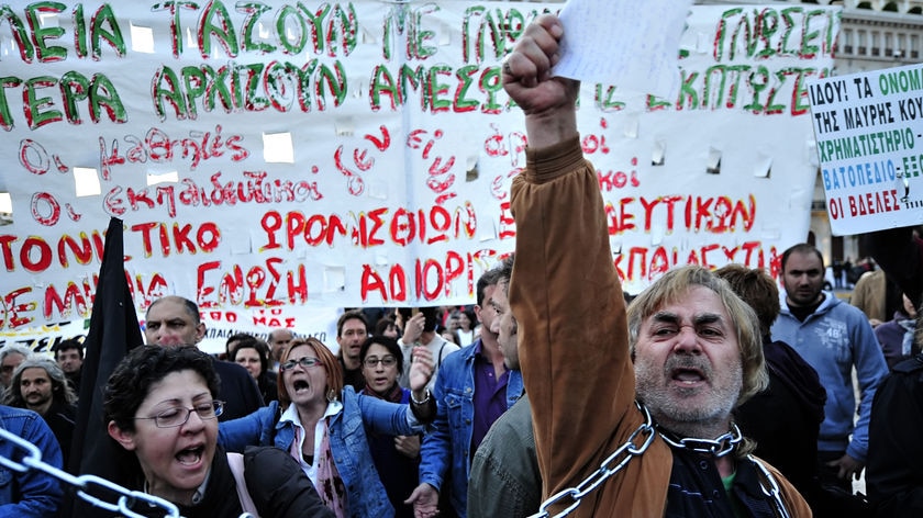 Demonstrators shout slogans against the Greek austerity measures.