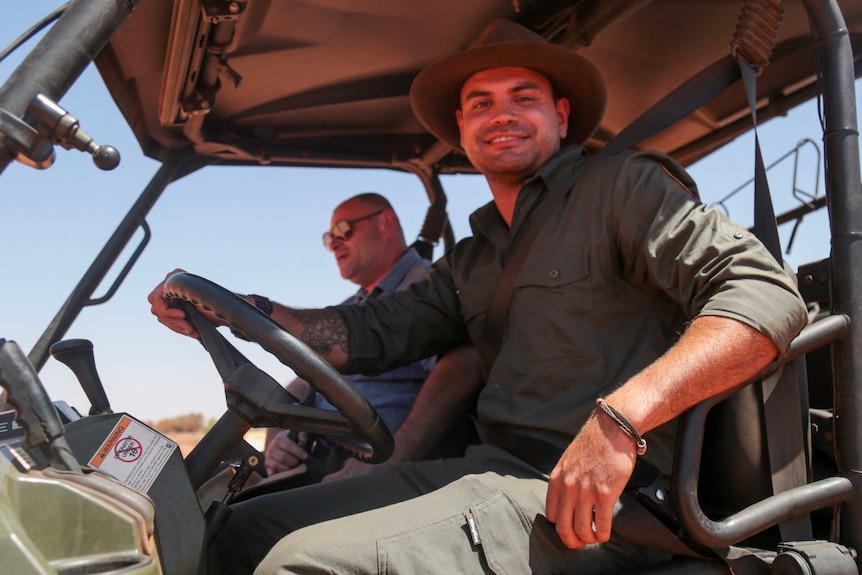 Tjiangu Thomas sits in a vehicle at Uluru