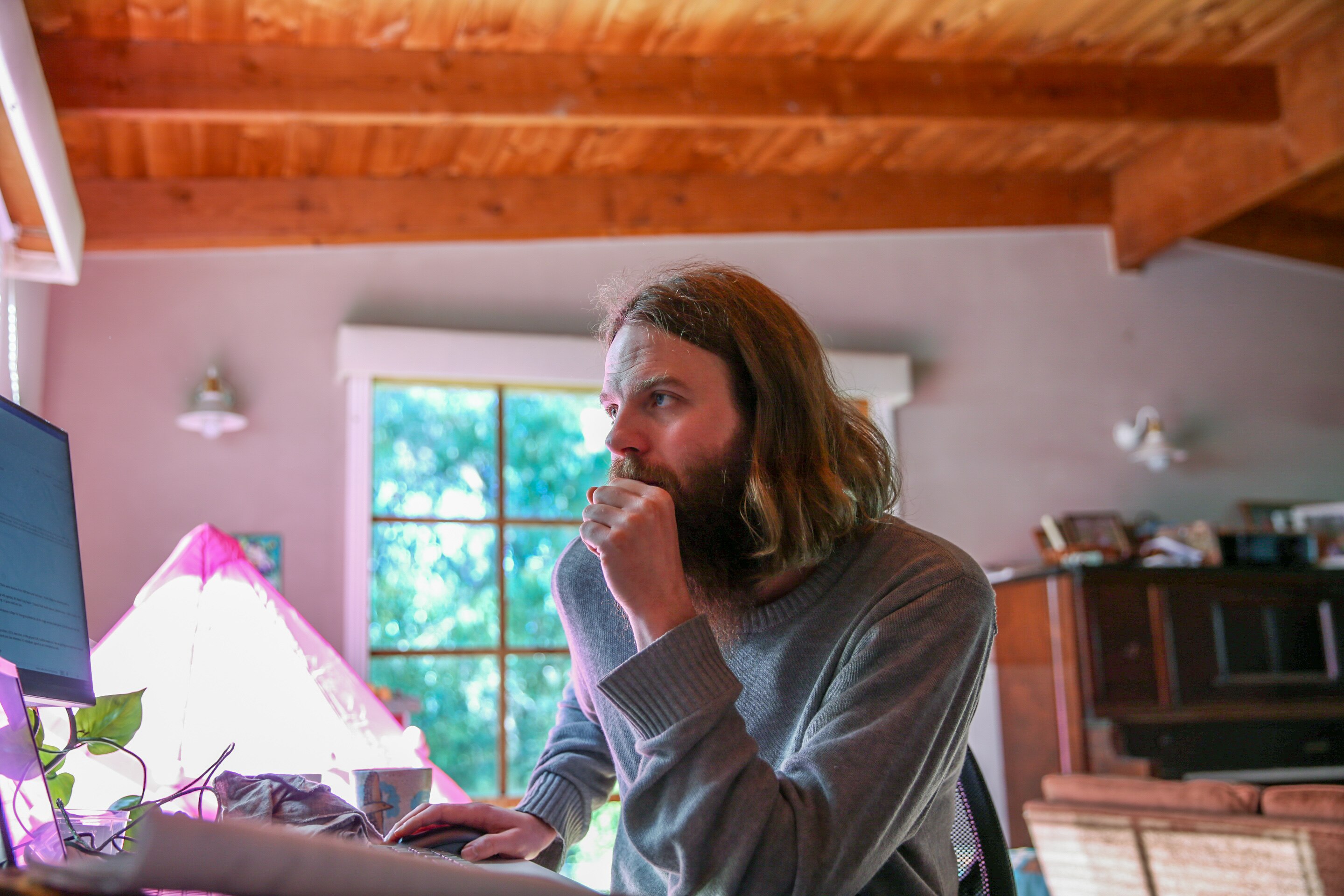 Leigh Read sitting on his desk