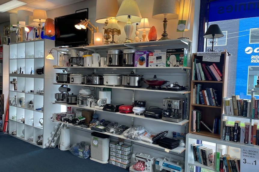 Shelves lined with electrical goods in a shop