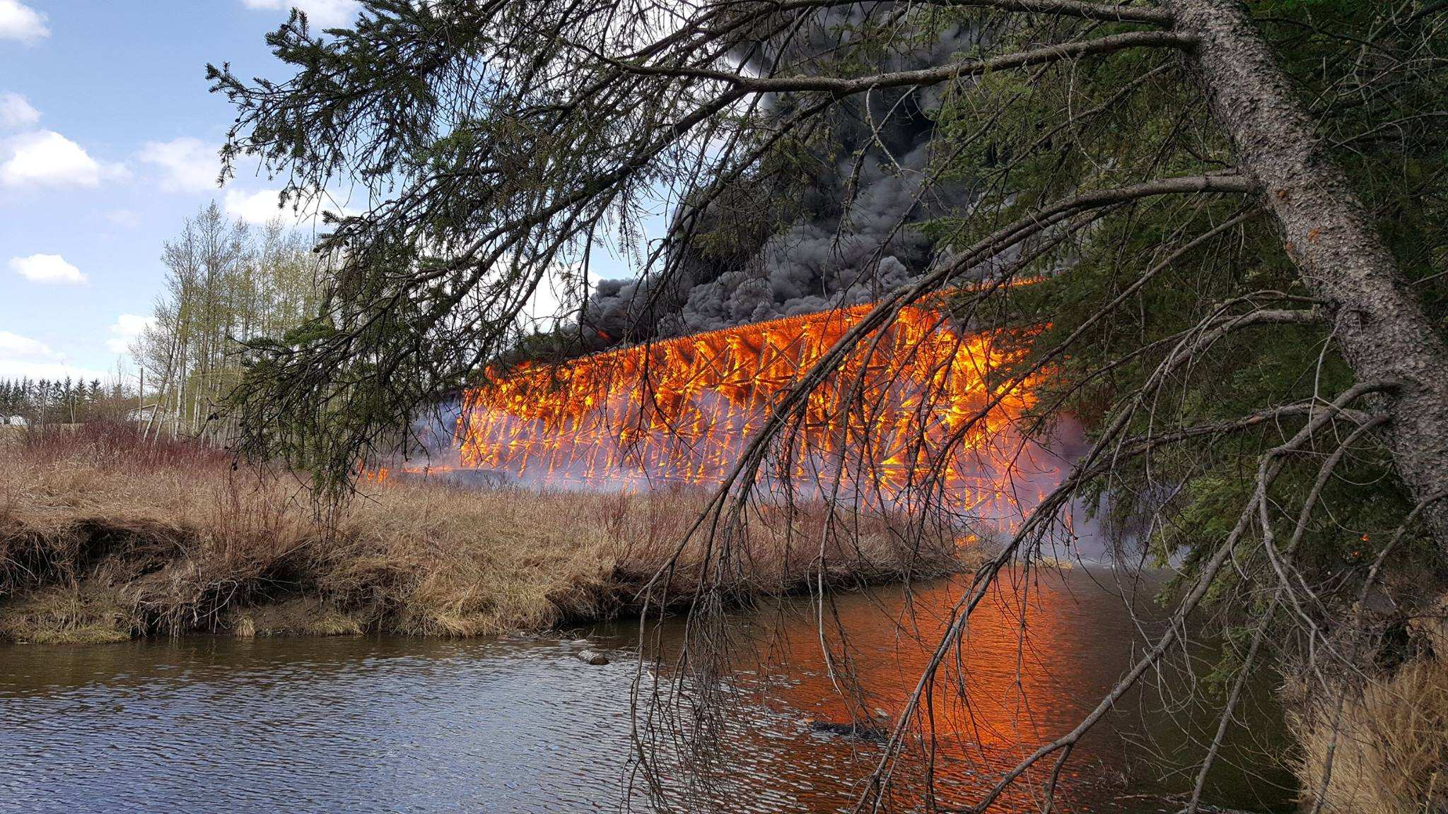 Canadian wooden trestle bridge destroyed in spectacular fire in Alberta