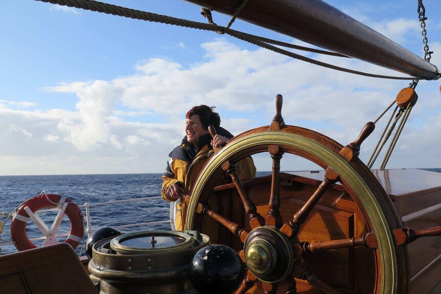 A woman at the steering wheel of James Craig