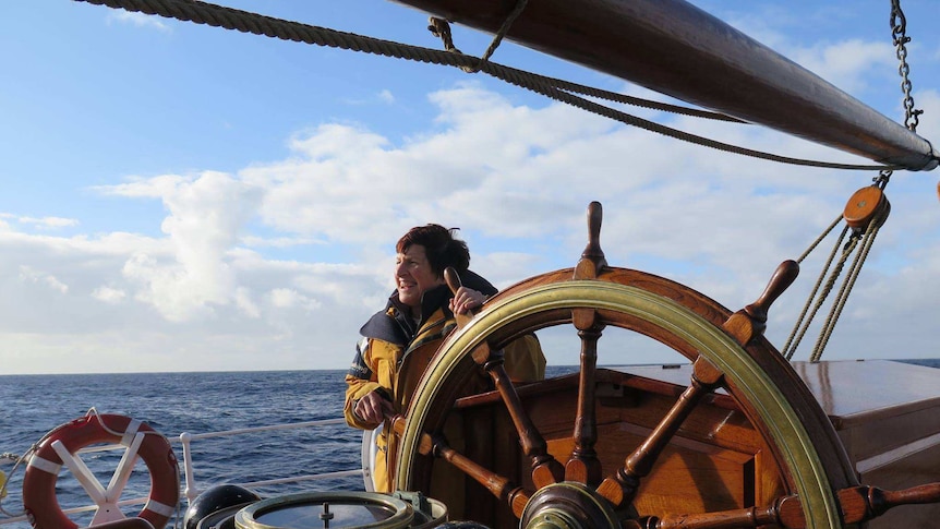 A woman at the steering wheel of James Craig