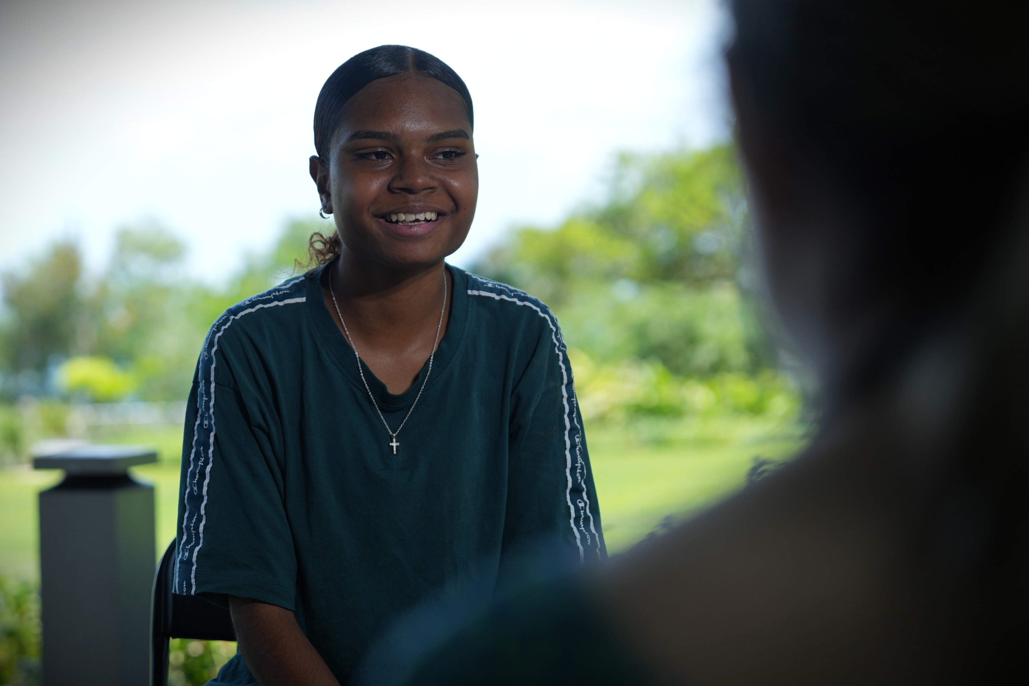 Portrait of a teenager being filmed during a camera interview.