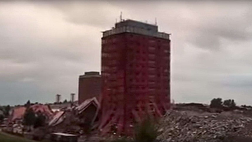Two tower blocks at the Red Road Flats in Glasgow remain standing after a controlled demolition.