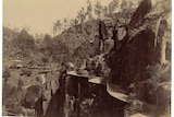 Old photo of the view towards a rotunda overlooking cliff walkway, at Launceston's Cataract Gorge.