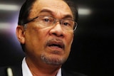 Malaysia's opposition leader Anwar Ibrahim speaks to the media