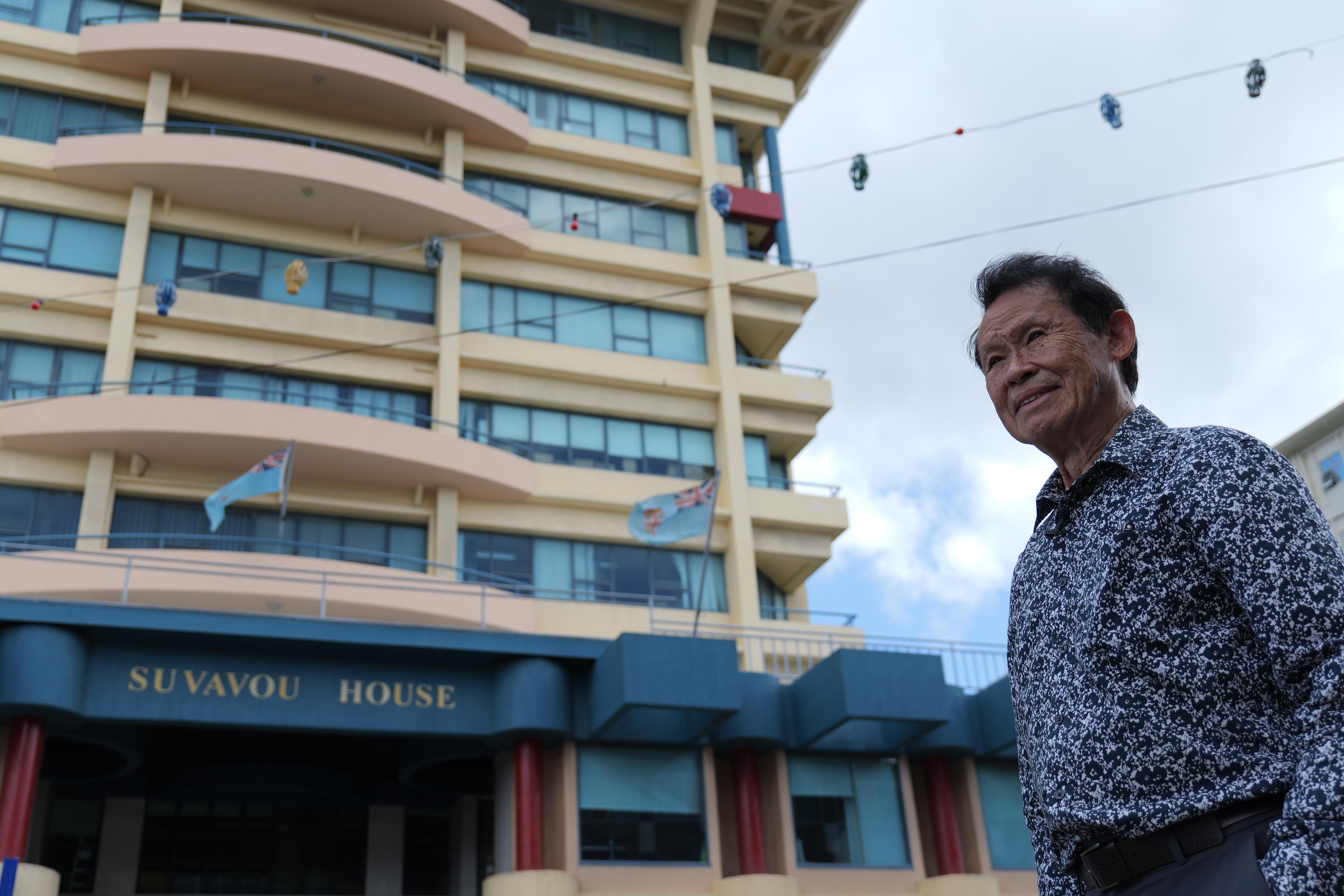 Kenneth stands in front of his architectural design.