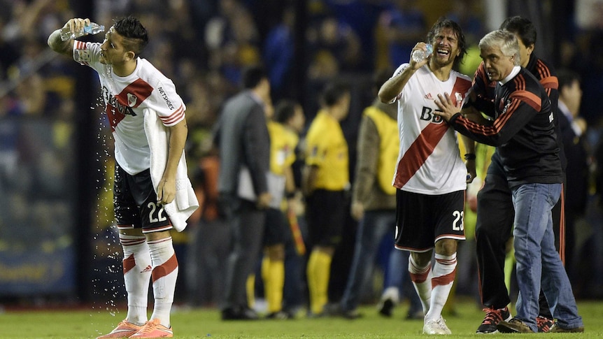 River Plate players after being pepper sprayed by Boca Juniors fans