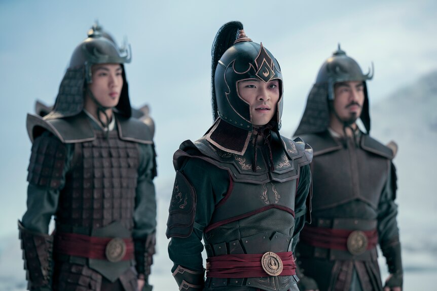 A TV still of Dallas James Liu dressed in armour, including a helmet. He has a black eye.