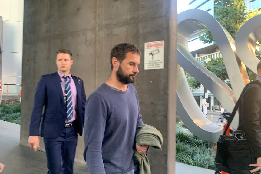 Przemyslaw "Sam" Sobczak walking into court.