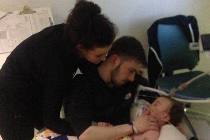 Alfie and his parents in hospital