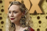 Game of Thrones star Gwendoline Christie, wearing ornate jewellery and a dress in the style of Westeros royalty