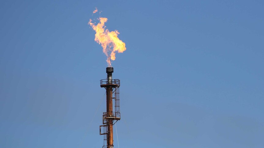 A flame on top of an oil refinery pole good generic Kwinana BP WA.