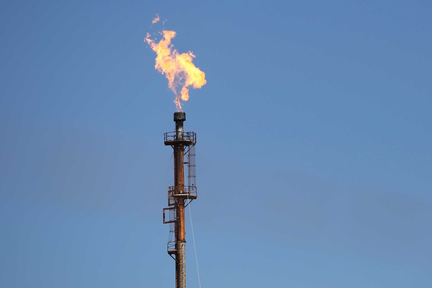 A flame on top of an oil refinery pole good generic Kwinana BP WA.