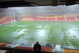 Heavy rain falls pooling at Lang Park ahead of the Australia v New Zealand rugby league Test match.