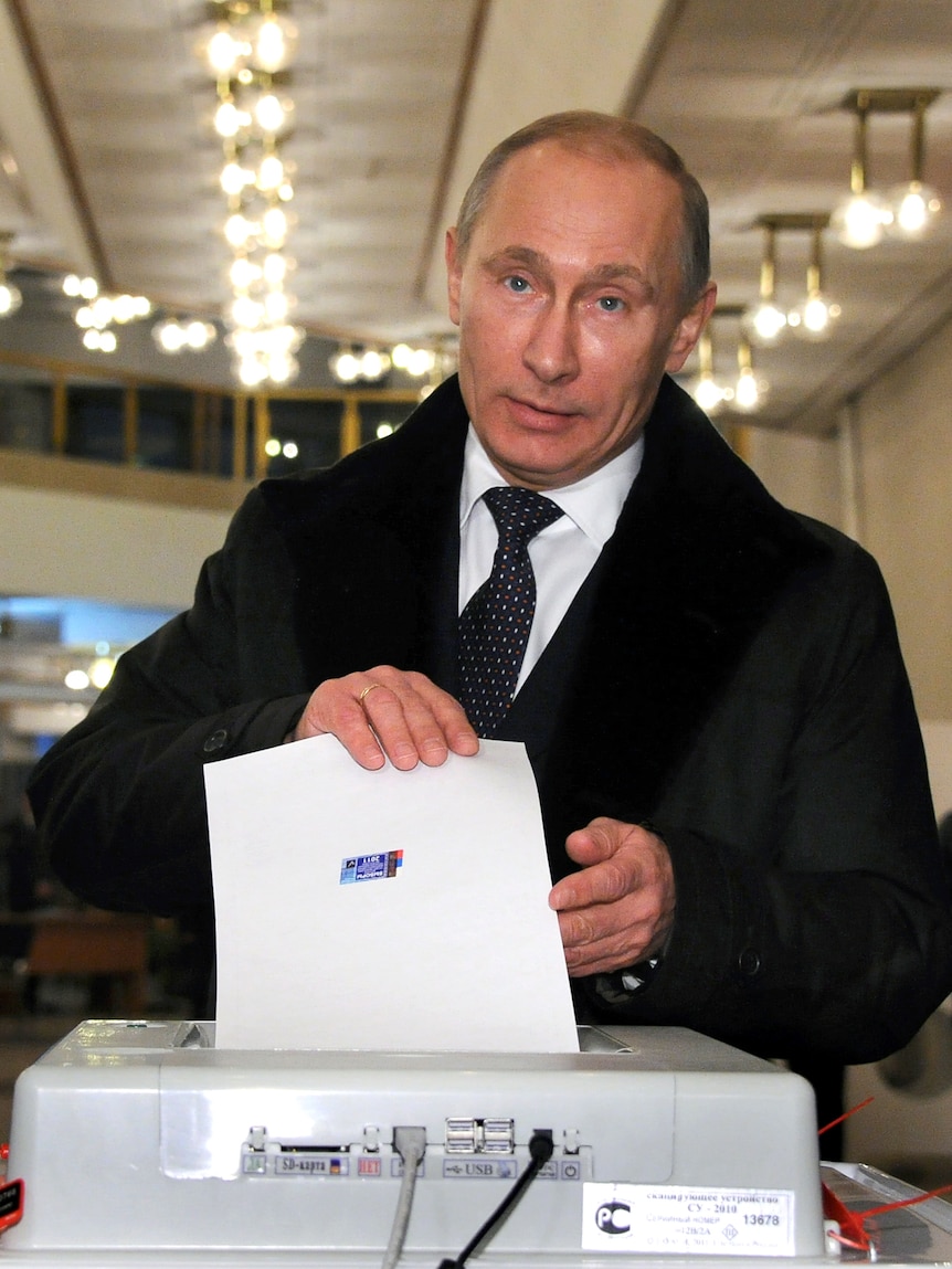 Russia's Prime Minister Vladimir Putin votes for parliamentary election at a polling station in Moscow.