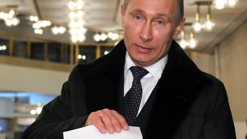 Russia's Prime Minister Vladimir Putin votes for parliamentary election at a polling station in Moscow.