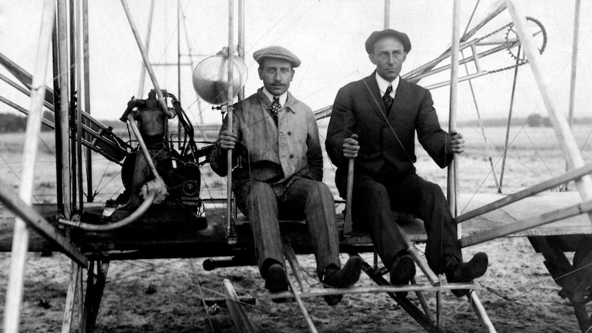 Black and white old photo of Wilbur and Orville wright on flyer I. 1910.
