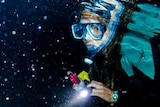 Caitlin snorkelling at night