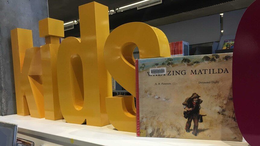 The book Waltzing Matilda on the library shelves.