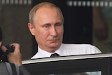 Vladimir Putin leaves his Brisbane hotel