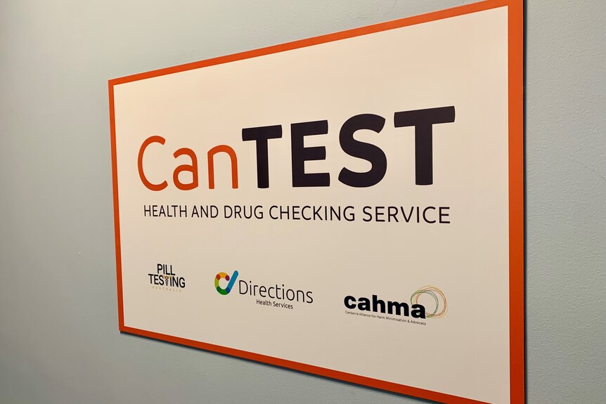 a sign that reads 'cantest' health and drug checking service