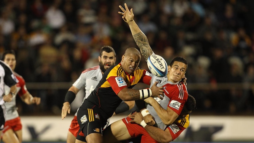 Sonny Bill Williams is hunted down by the Chiefs defence.