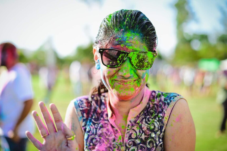 A woman covered in coloured powder at Brisbane's Holi Festival