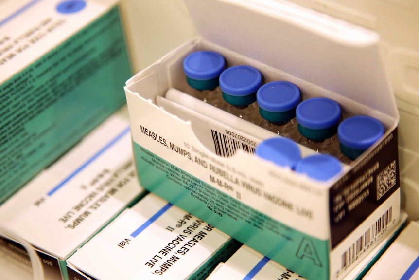 Vials of measles, mumps and rubella vaccine in a packet.