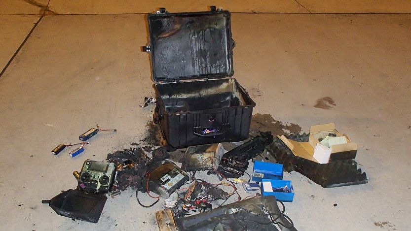 Fire damaged bag and contents, removed from a plane at Melbourne Airport.