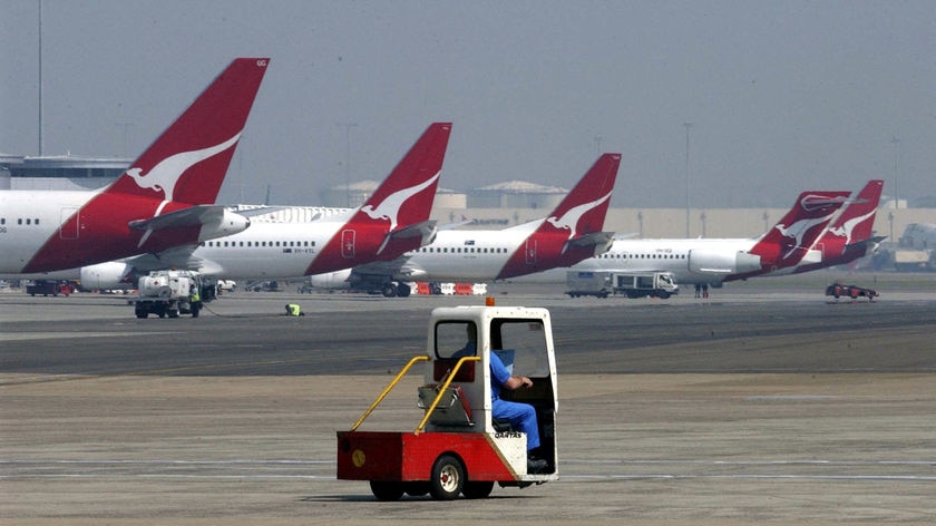 Qantas planes sit at Sydney Airport