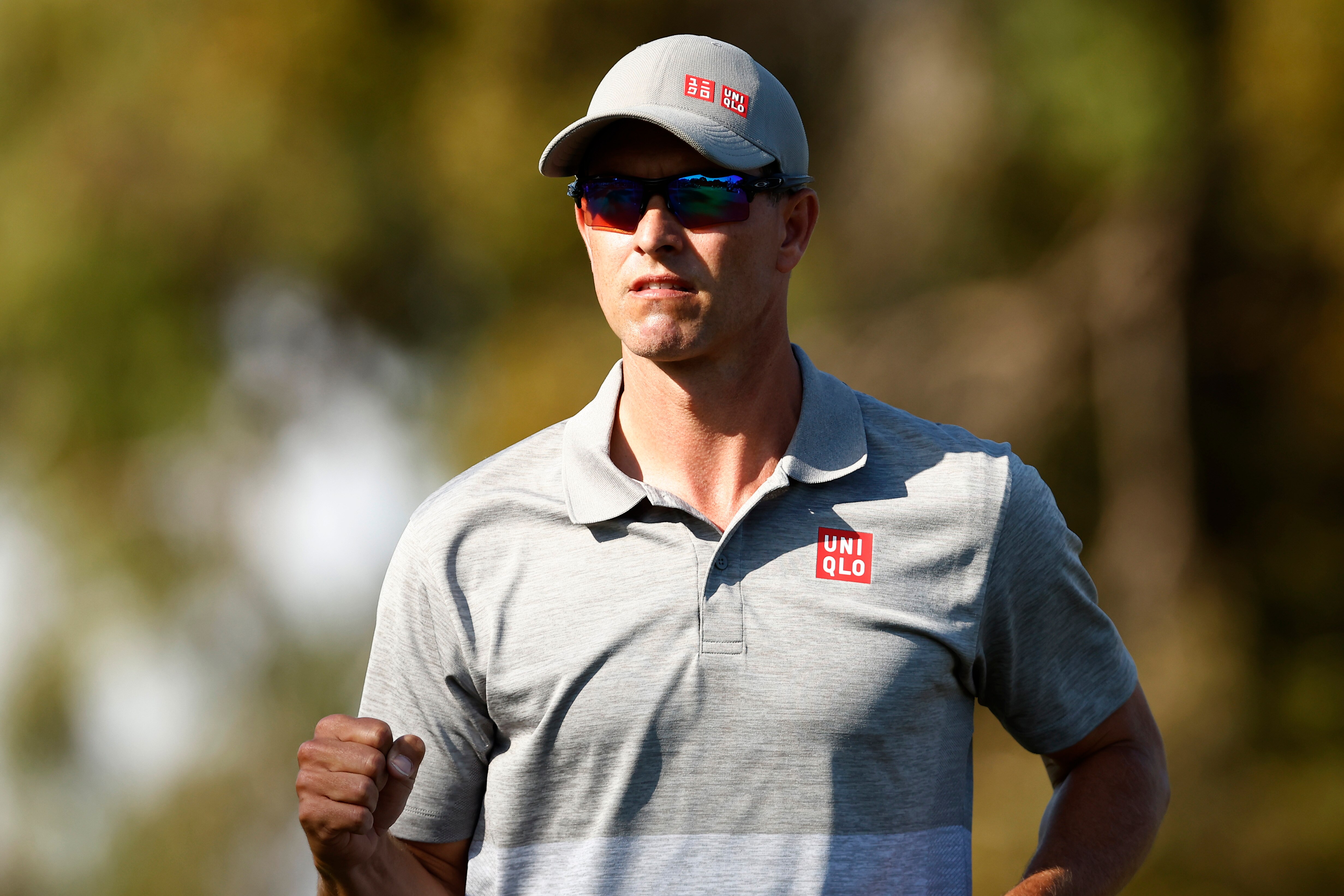 An Australian male golfer pumps his right fist at the Australian Open.