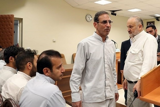 Vahid Mazloumin is seen appearing in court for the first time on charges of manipulating the currency market.