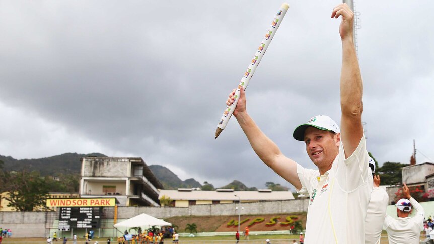 Adam Voges celebrates after Australia's first Test win over West Indies in Dominica.