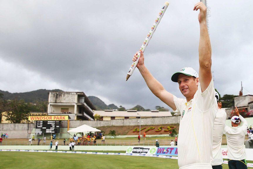 Adam Voges celebrates after Australia's first Test win over West Indies in Dominica.