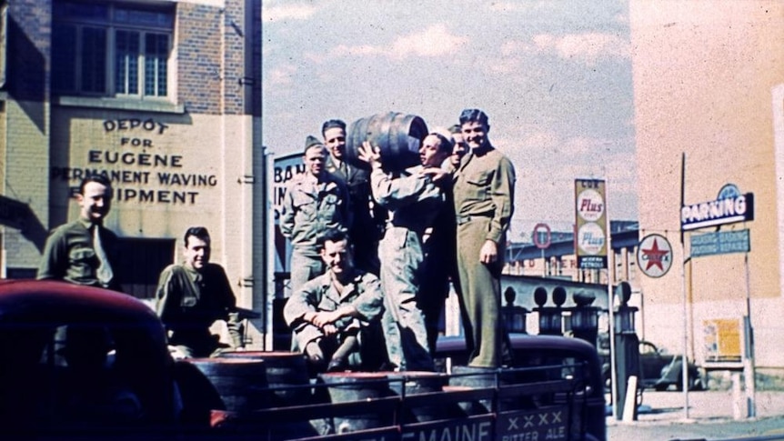 Soldiers on the back of a Castlemaine Brewery truck in Charlotte Street, Brisbane in the 1940s.