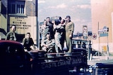 Soldiers on the back of a Castlemaine Brewery truck in Charlotte Street, Brisbane in the 1940s.