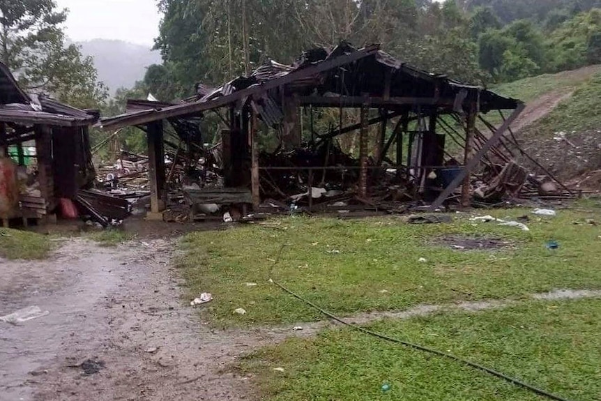 debris and broken hut in rural Kachin state