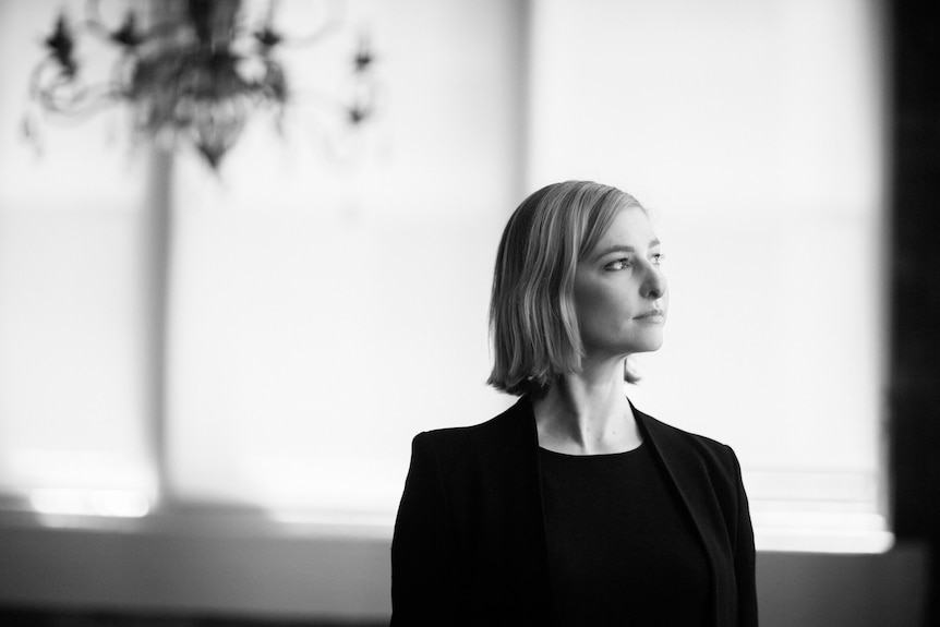 Professor Ellie Rennie standing for a portait photograph.