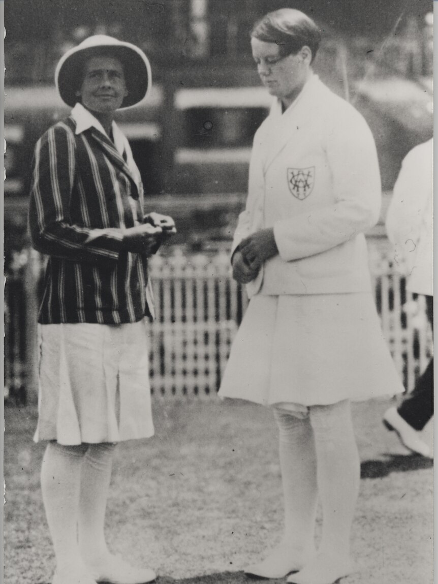Black and white photographic enlargement of Margaret Peden and Betty Archdale tossing the coin.