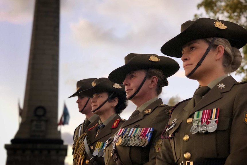 Four servicewomen standing in a line at Hobart's Dawn Service.